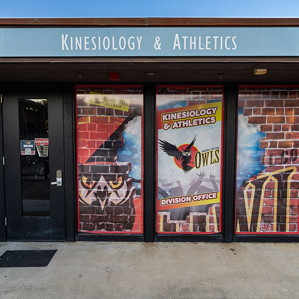 Outside an office with Foothill Own logo