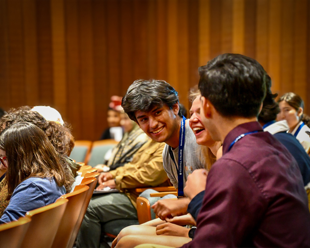 Students at the auditorium smiling