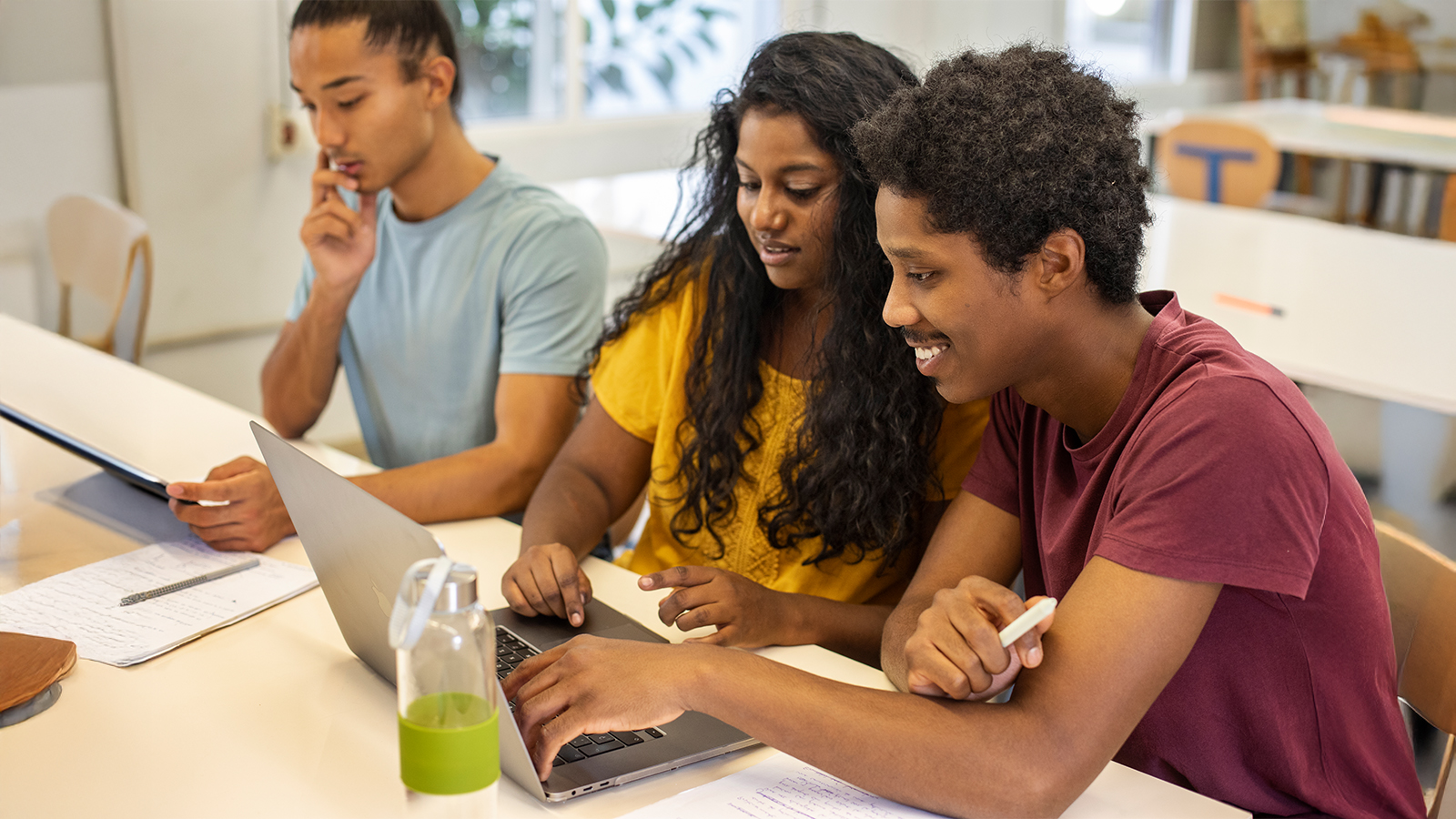 Diverse group of students doing homework