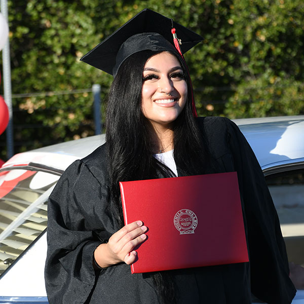 woman in graduation cap and gown