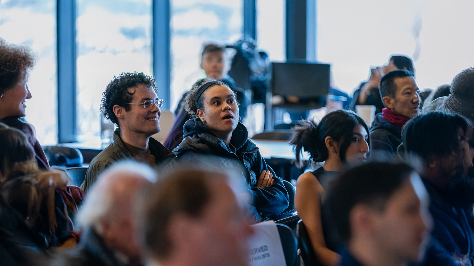 Female student with a surprising face at a workshop