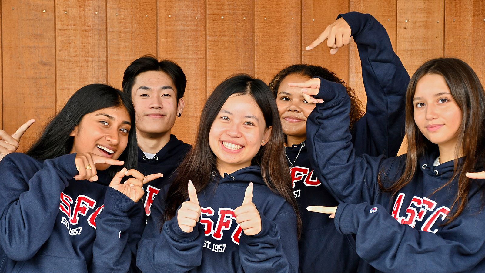 A diverse group of students wearing ASFC trees 