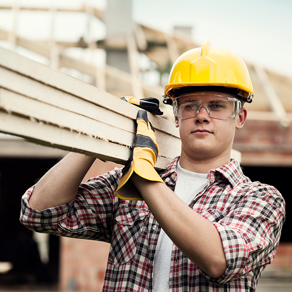 Male young worker with good bricks working in a construction