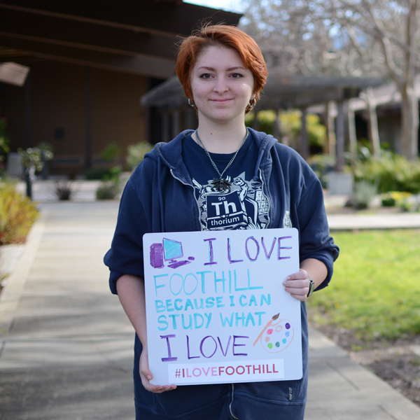 Male and female student in graduation receiving certificates