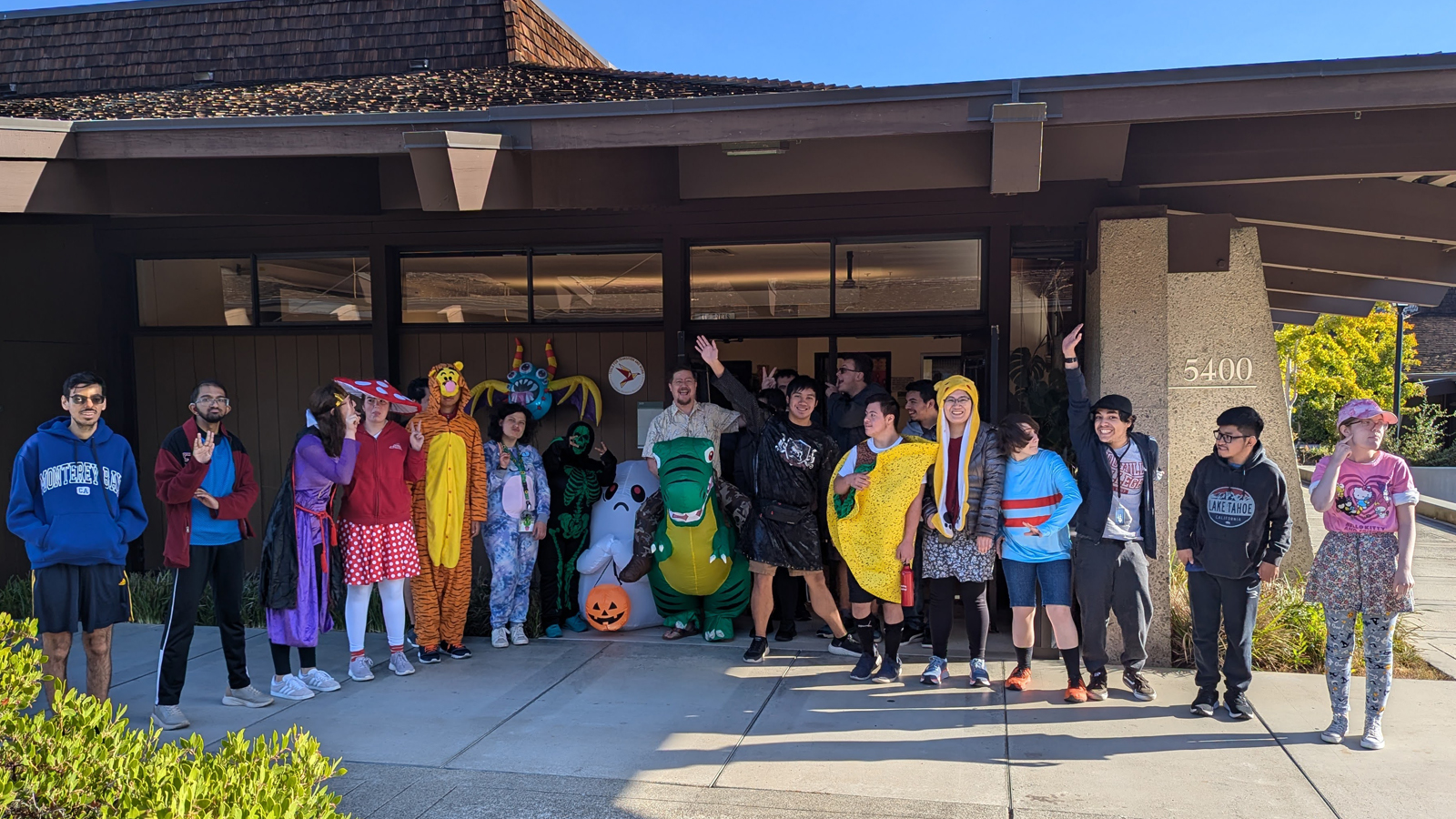 A diverse group of TTW students in Halloween costumes.